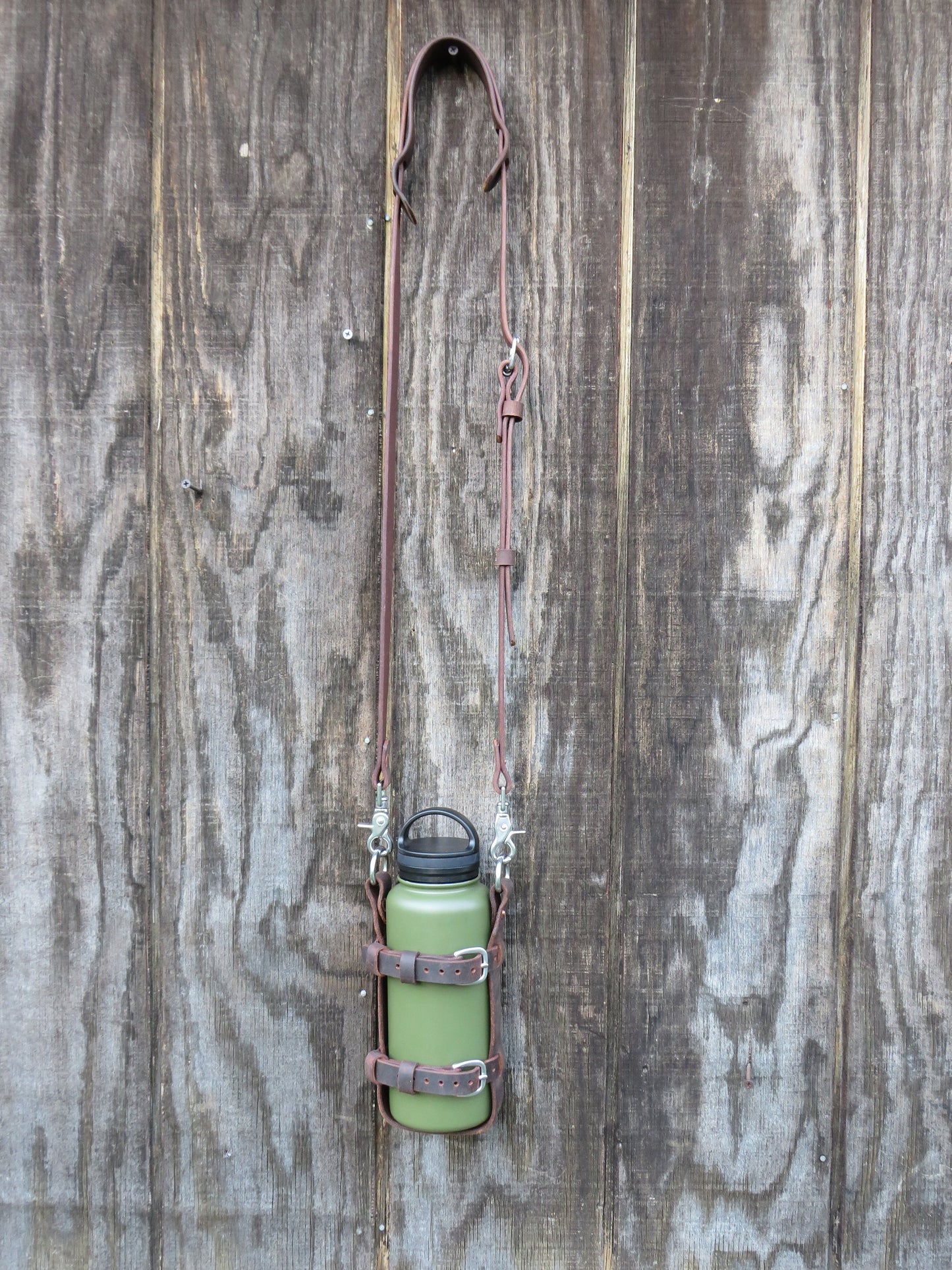 Adjustable Full Grain leather water bottle carrier with shoulder strap, Stainless Steel buckles and full grain leather custom made to fit