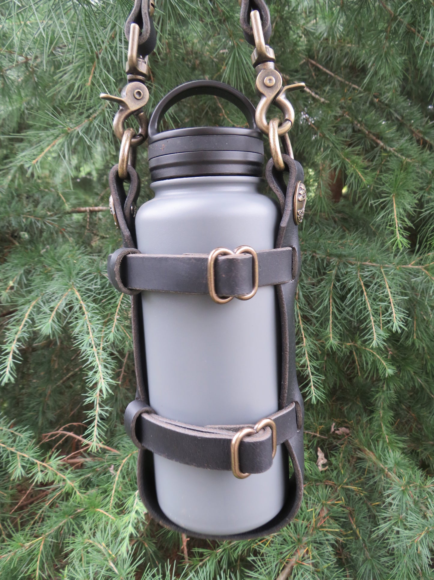 Adjustable leather water bottle carrier with shoulder strap