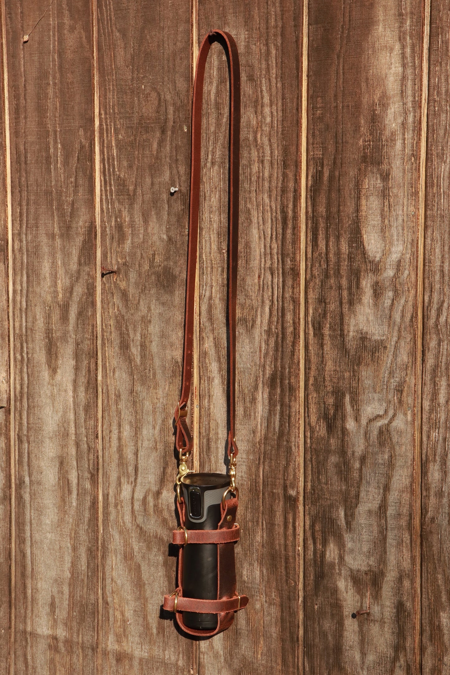 Adjustable Full Grain Water Buffalo leather water bottle carrier with shoulder strap,can be made to fit any bottle, handmade, custom leather