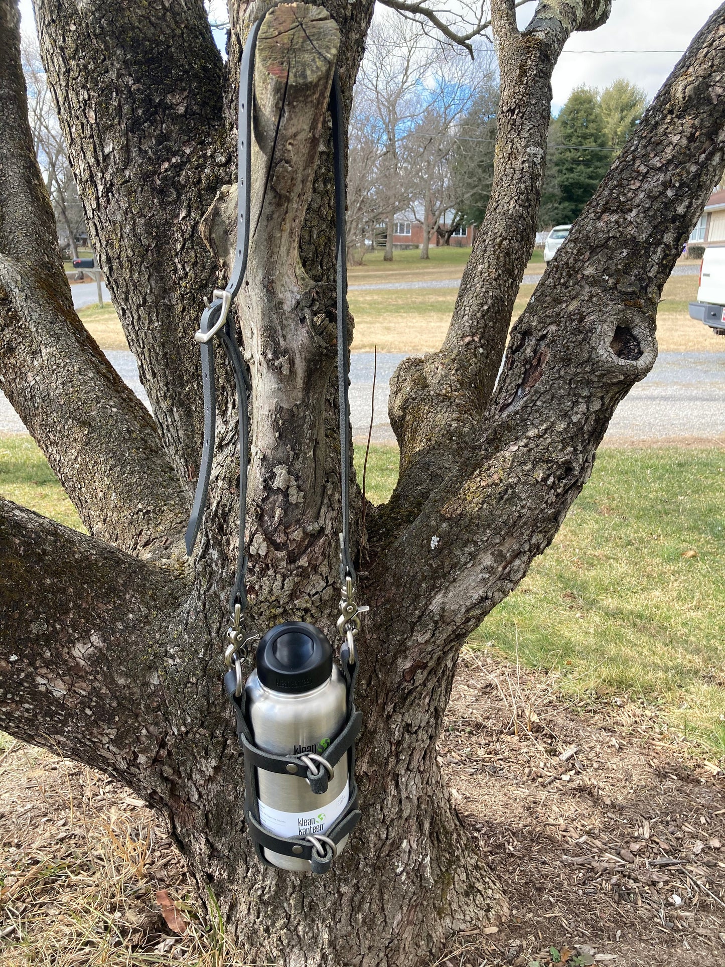 Adjustable Full Grain Black Water Buffalo leather water bottle carrier with shoulder strap