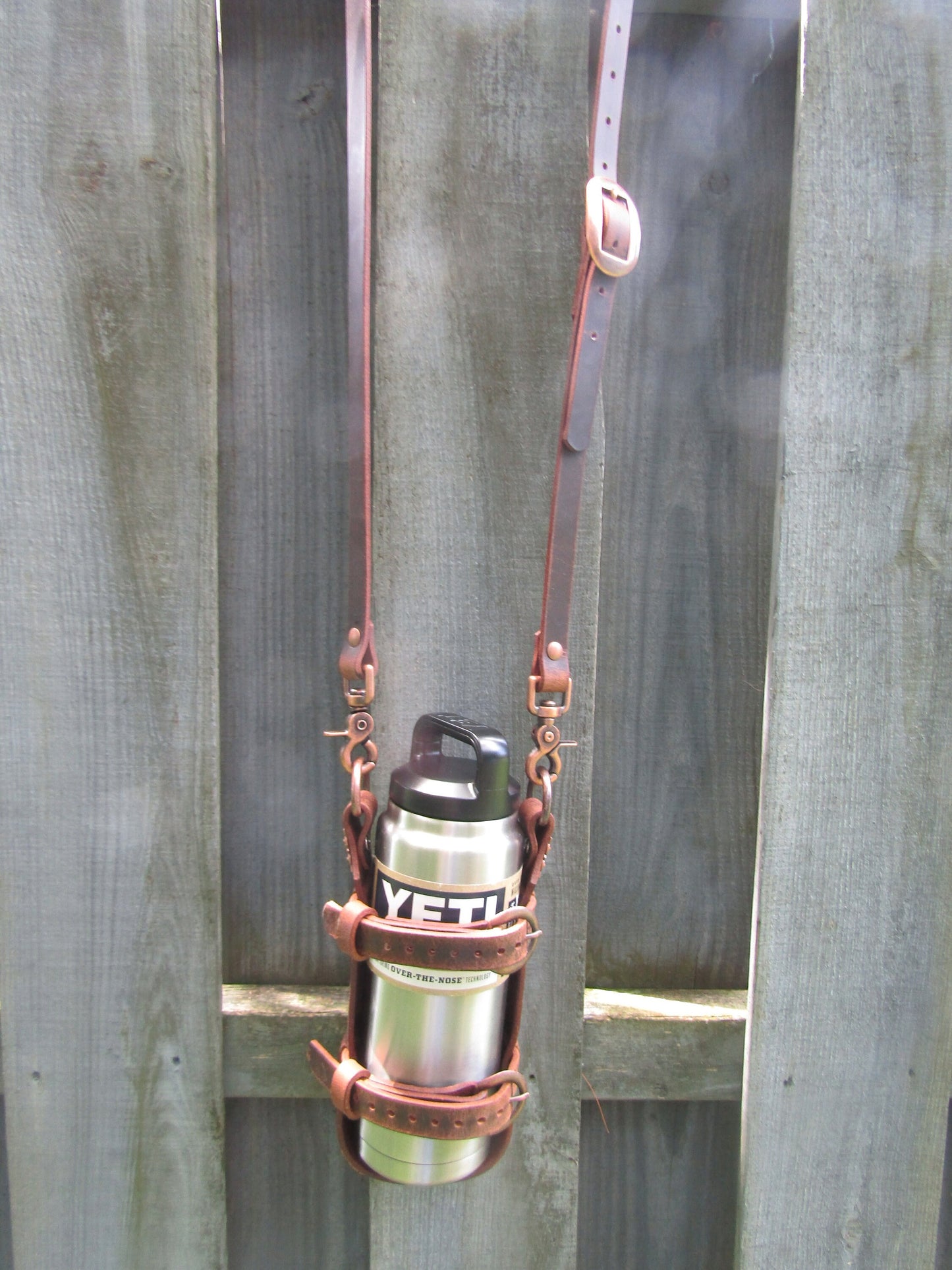 Adjustable Full Grain Water Buffalo leather water bottle carrier with shoulder strap, copper finish conchos