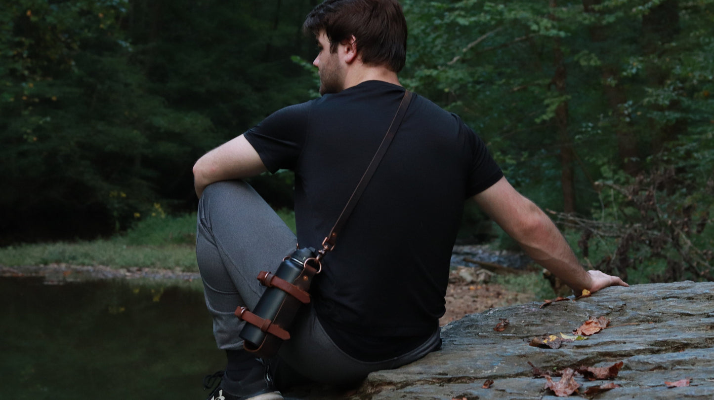 Adjustable Full Grain Water Buffalo leather water bottle carrier with shoulder strap, antique copper hardware, can be made to fit any bottle