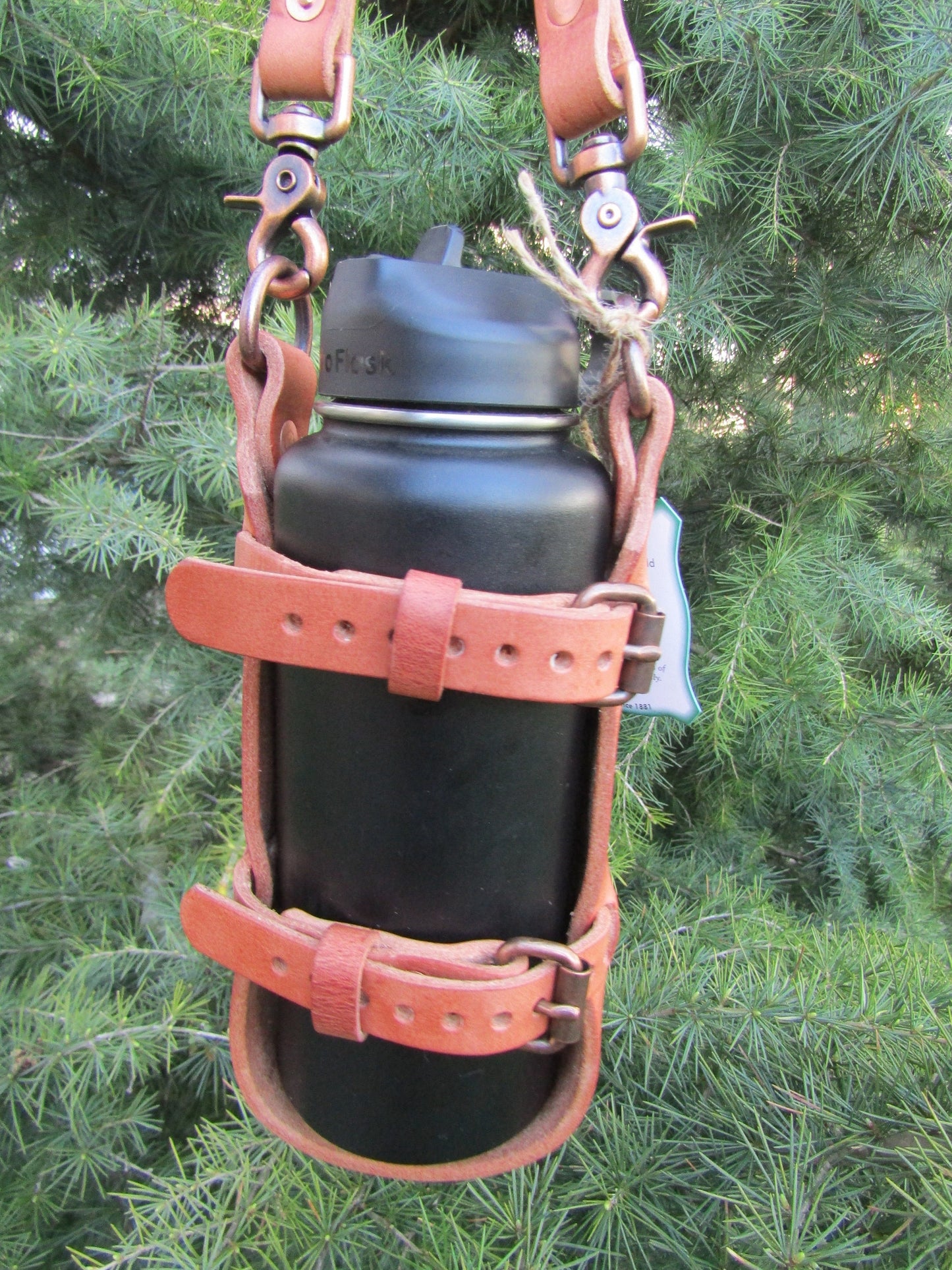 Adjustable Hermann Oak harness leather water bottle carrier with shoulder strap, antique copper finish hardware