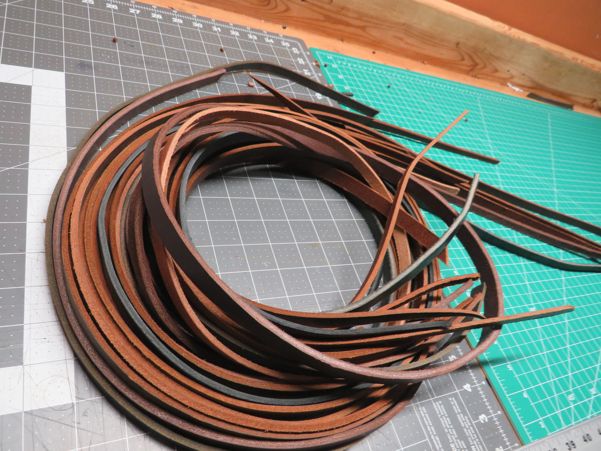 3 pounds of veg tanned leather straps  1/2" and 1/4" wide