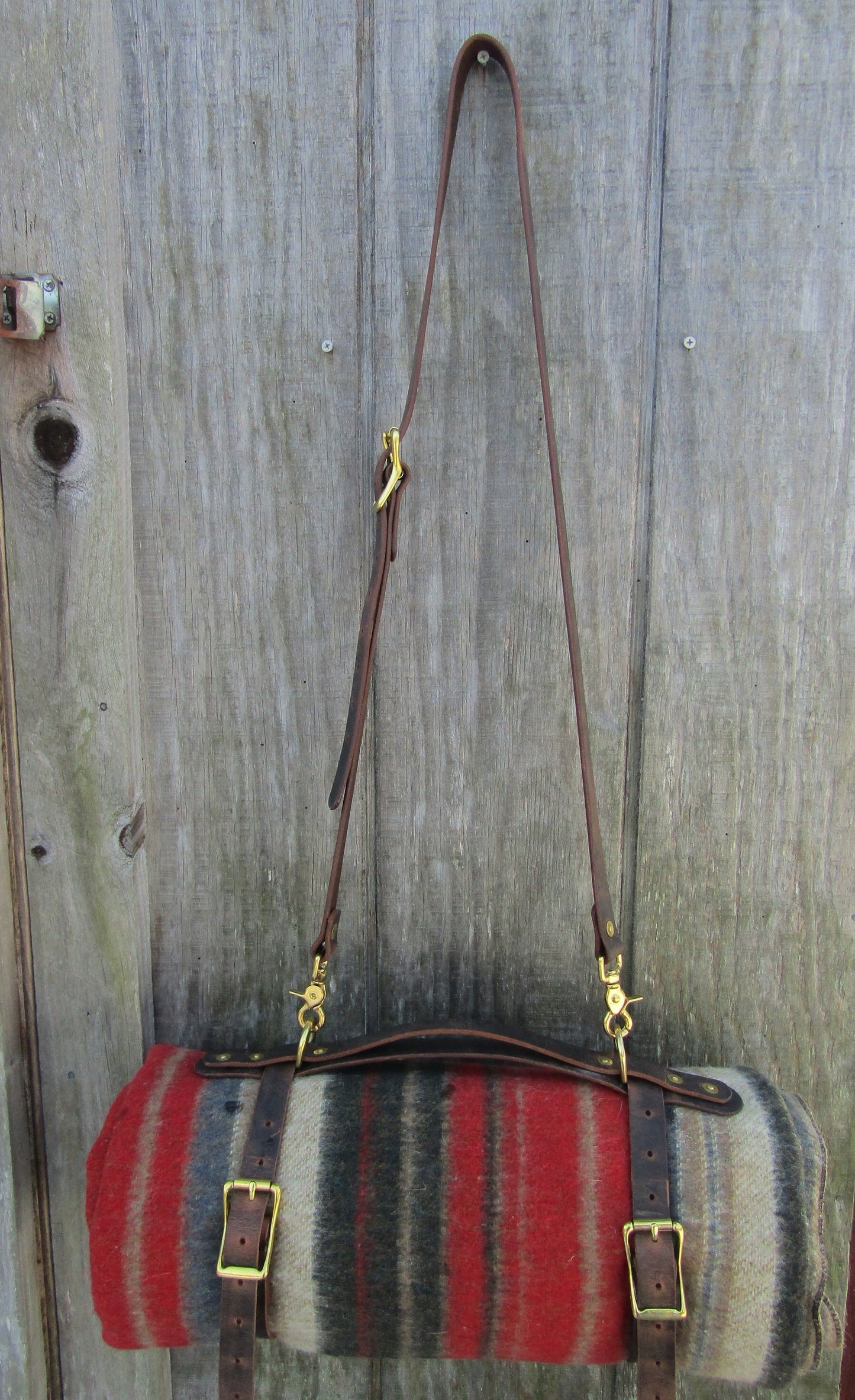 Hand made Crazy Horse Water Buffalo veg tanned leather blanket carrier/ blanket harness/bedroll, solid brass rivets and hardware