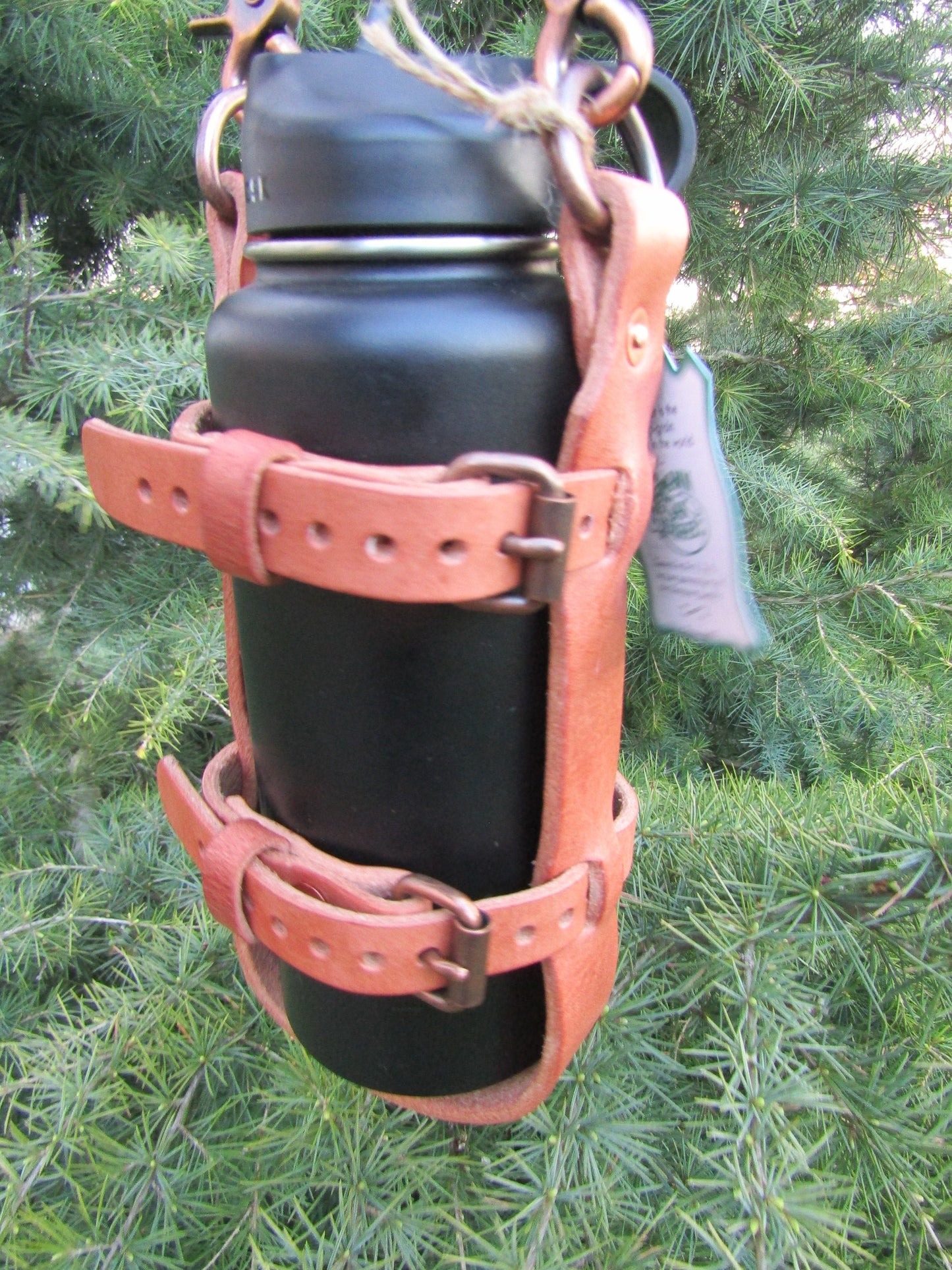 Adjustable Hermann Oak harness leather water bottle carrier with shoulder strap, antique copper finish hardware