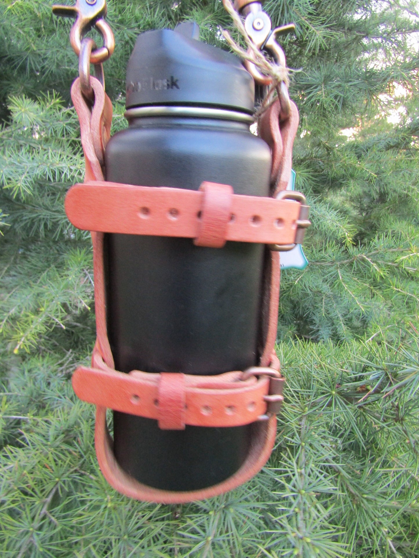Adjustable Hermann Oak harness leather water bottle carrier with shoulder strap, antique copper finish hardware