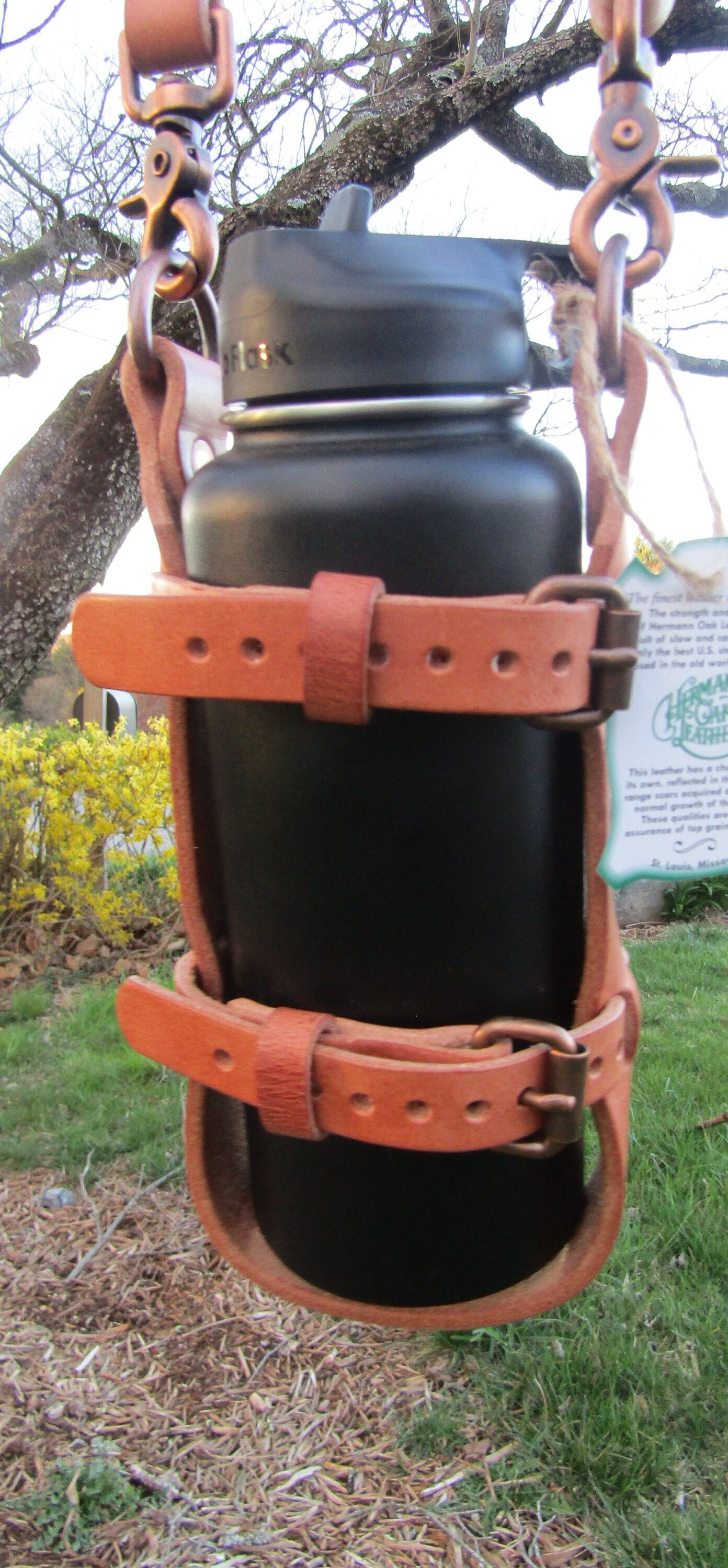 Adjustable Hermann Oak harness leather water bottle carrier with shoulder strap, antique copper finish hardware